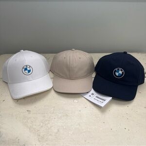 BMW Logo Caps in White, Tan, and Black